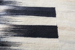 Backside of handmade New Kilim Kiasar rug showing knot structure and weave density