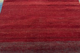 Backside of handmade New Kilim Kiasar rug showing knot structure and weave density