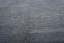 Backside of handmade New Kilim Kiasar rug showing knot structure and weave density