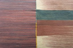 Backside of handmade New Kilim Kiasar rug showing knot structure and weave density