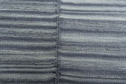 Backside of handmade New Kilim Kiasar rug showing knot structure and weave density