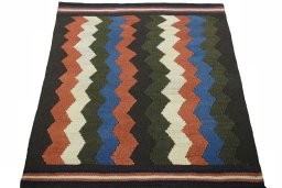 Close-up detail of New Kilim Sofre rug from Iran / Persia showing Wool weave