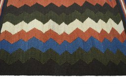 Close-up detail of New Kilim Sofre rug from Iran / Persia showing Wool weave