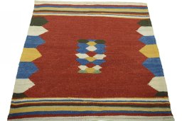 Close-up detail of New Kilim Sofre rug from Iran / Persia showing Wool weave