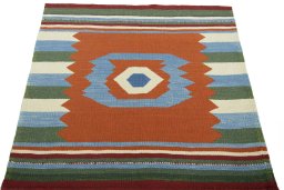 Close-up detail of New Kilim Sofre rug from Iran / Persia showing Wool weave