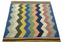 Close-up detail of New Kilim Sofre rug from Iran / Persia showing Wool weave