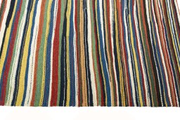 Close-up detail of New Kilim Sofre rug from Iran / Persia showing Wool weave
