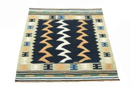 Close-up detail of New Kilim Sofre rug from Iran / Persia showing Wool weave