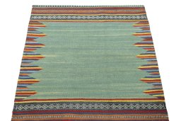 Close-up detail of New Kilim Sofre rug from Iran / Persia showing Wool weave