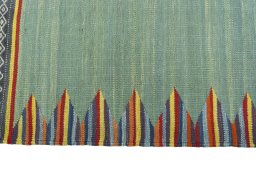 Close-up detail of New Kilim Sofre rug from Iran / Persia showing Wool weave