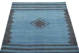 Close-up detail of New Kilim Sofre rug from Iran / Persia showing Wool weave