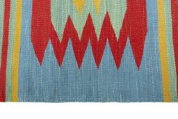 Close-up detail of New Kilim Sofre rug from Iran / Persia showing Wool weave