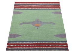 Close-up detail of New Kilim Sofre rug from Iran / Persia showing Wool weave