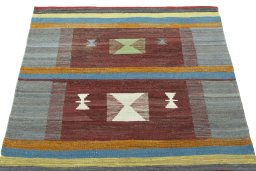 Close-up detail of New Kilim Sofre rug from Iran / Persia showing Wool weave