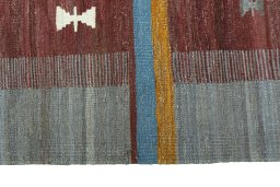 Close-up detail of New Kilim Sofre rug from Iran / Persia showing Wool weave
