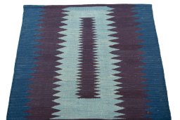 Close-up detail of New Kilim Sofre rug from Iran / Persia showing Wool weave