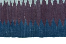 Close-up detail of New Kilim Sofre rug from Iran / Persia showing Wool weave