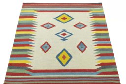 Close-up detail of New Kilim Sofre rug from Iran / Persia showing Wool weave