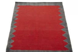 Close-up detail of New Kilim Sofre rug from Iran / Persia showing Wool weave