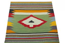 Close-up detail of New Kilim Sofre rug from Iran / Persia showing Wool weave