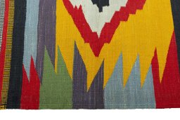 Close-up detail of New Kilim Sofre rug from Iran / Persia showing Wool weave