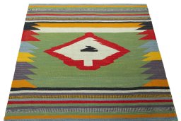 Close-up detail of New Kilim Sofre rug from Iran / Persia showing Wool weave