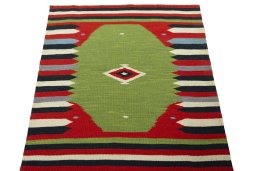 Close-up detail of New Kilim Sofre rug from Iran / Persia showing Wool weave