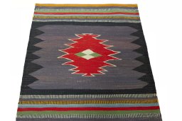 Close-up detail of New Kilim Sofre rug from Iran / Persia showing Wool weave