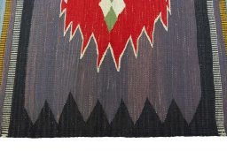 Close-up detail of New Kilim Sofre rug from Iran / Persia showing Wool weave