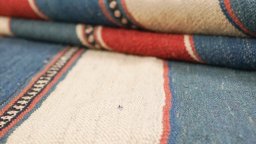 Close-up detail of 1980s Modern Design rug from Iran / Persia showing Wool weave