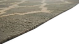 Backside of handmade New Modern Design rug showing knot structure and weave density