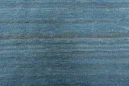 Backside of handmade New Modern Design rug showing knot structure and weave density