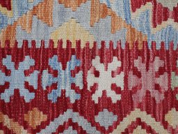 Backside of handmade New Modern Design rug showing knot structure and weave density