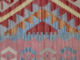 Backside of handmade New Modern Design rug showing knot structure and weave density