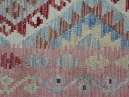 Backside of handmade New Modern Design rug showing knot structure and weave density