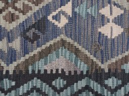 Backside of handmade New Modern Design rug showing knot structure and weave density