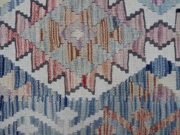 Backside of handmade New Modern Design rug showing knot structure and weave density