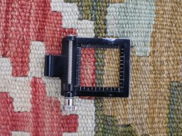 Corner detail of New Modern Design rug showing border pattern and Wool pile