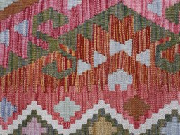 Backside of handmade New Modern Design rug showing knot structure and weave density