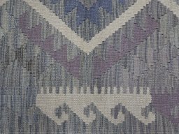 Backside of handmade New Modern Design rug showing knot structure and weave density