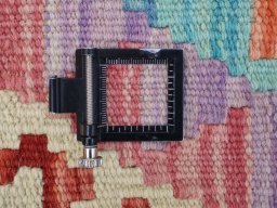 Corner detail of New Modern Design rug showing border pattern and Wool pile