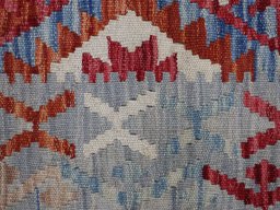 Backside of handmade New Modern Design rug showing knot structure and weave density