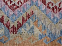 Backside of handmade New Modern Design rug showing knot structure and weave density