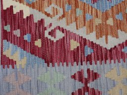 Backside of handmade New Modern Design rug showing knot structure and weave density