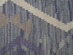 Backside of handmade New Modern Design rug showing knot structure and weave density