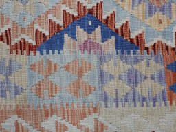 Backside of handmade New Modern Design rug showing knot structure and weave density