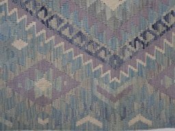 Backside of handmade New Modern Design rug showing knot structure and weave density