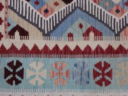 Backside of handmade New Modern Design rug showing knot structure and weave density