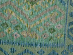 Backside of handmade New Modern Design rug showing knot structure and weave density