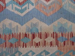 Backside of handmade New Modern Design rug showing knot structure and weave density